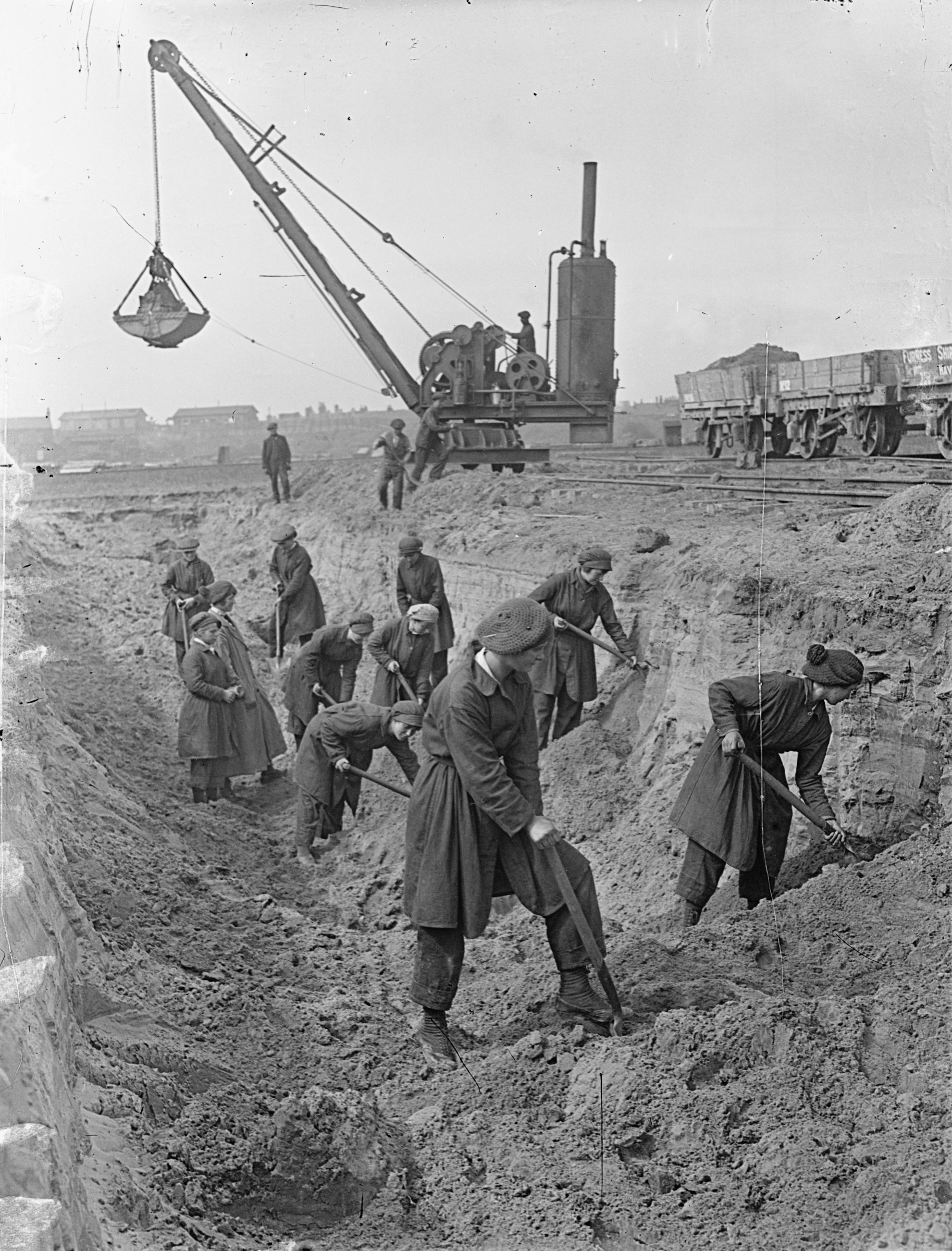 Female workers excavating a wet basin at Furness Shipbuilding Yard, Haverton Hill, Teesside. ©Crown Copyright.